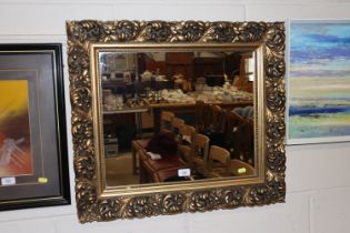 A gilt frame oblong wall mirror