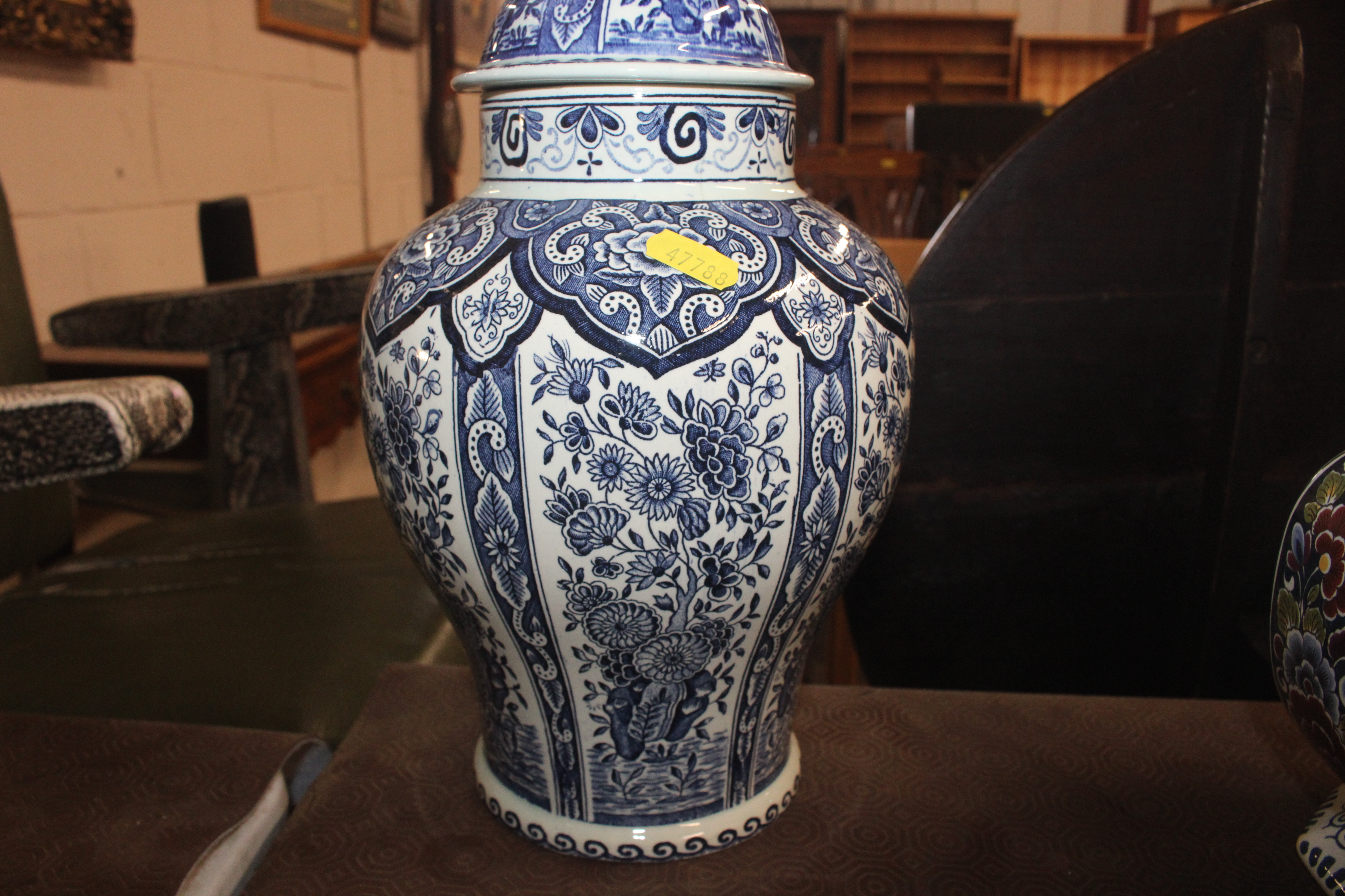 A Delft baluster vase and lid; a charger and three - Image 11 of 12