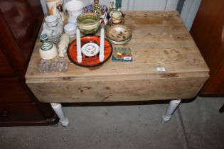 A part painted stripped pine drop leaf table raise