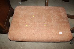 An upholstered footstool