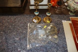 A pair of porcelain and brass candlesticks and a s