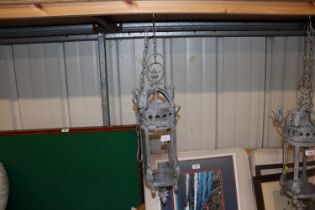 A metal and glass hanging lantern