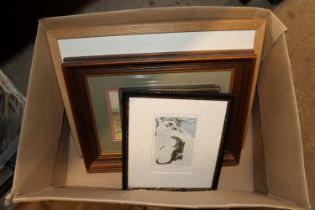 A box of various pictures and prints