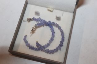 A pair of large tanzanite and sterling silver half