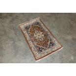 An approx. 3'5" x 2" Eastern pattered rug