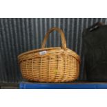 A woven wicker basket with twin lid