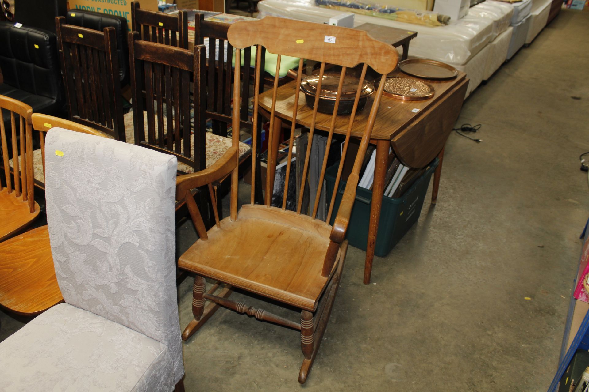 A stick back rocking chair