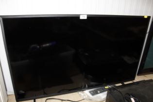 A Panasonic television with remote control