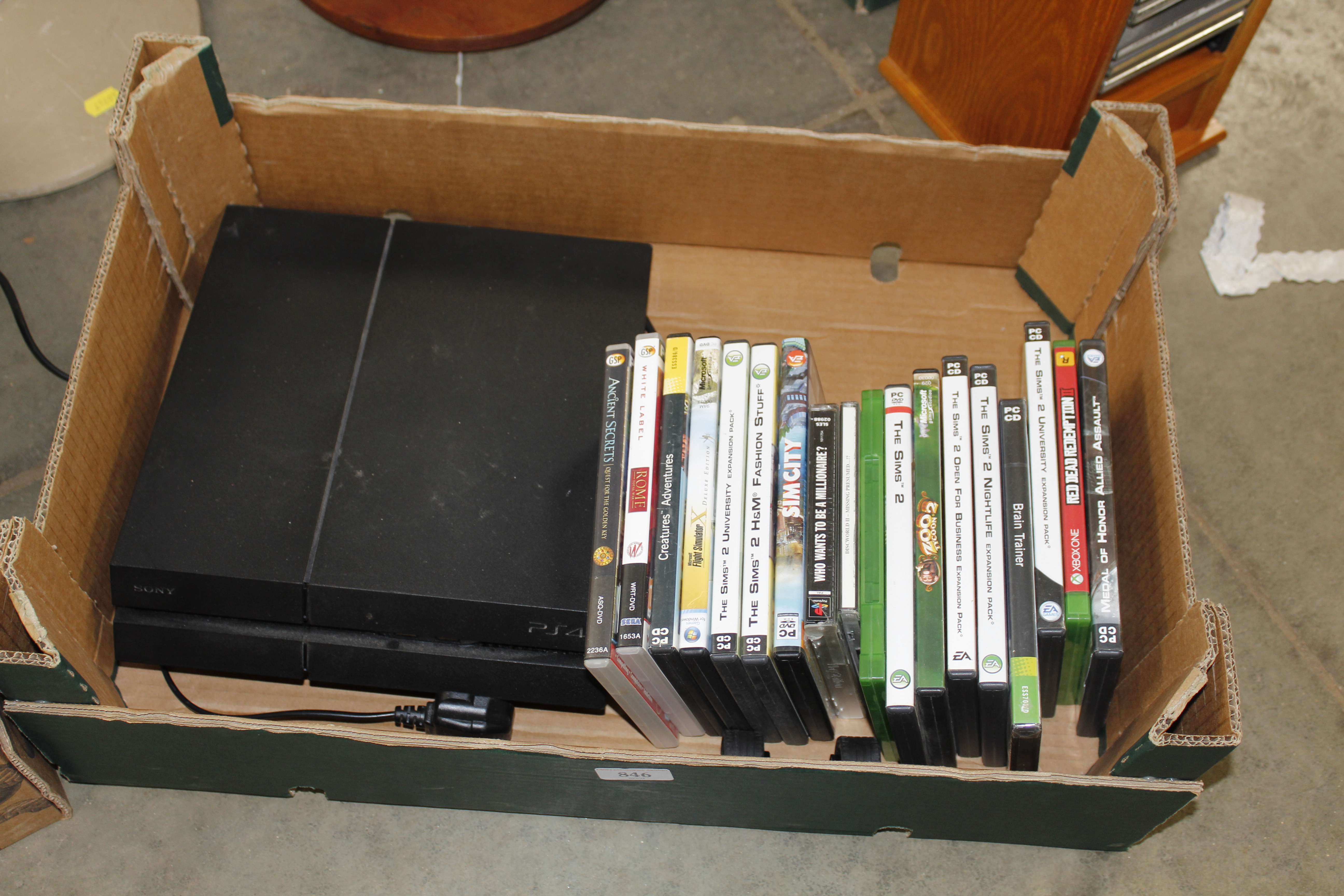 A Sony PlayStation IV and a collection of PC games