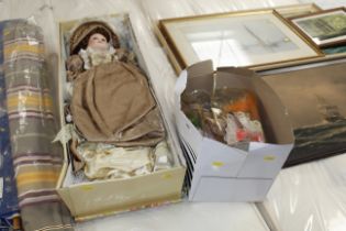 A large collectors doll and a box containing vario