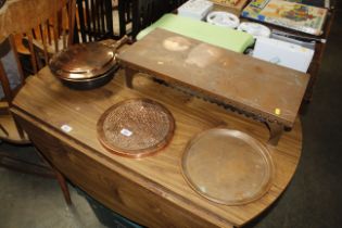 A copper warming pan, copper warming tray, two cop