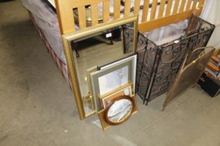 A gilt framed bevel edged wall mirror and a collec