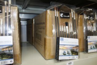 Two boxes containing sets of ten assorted paint brushes