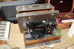 A Singer hand sewing machine 201K in fitted case