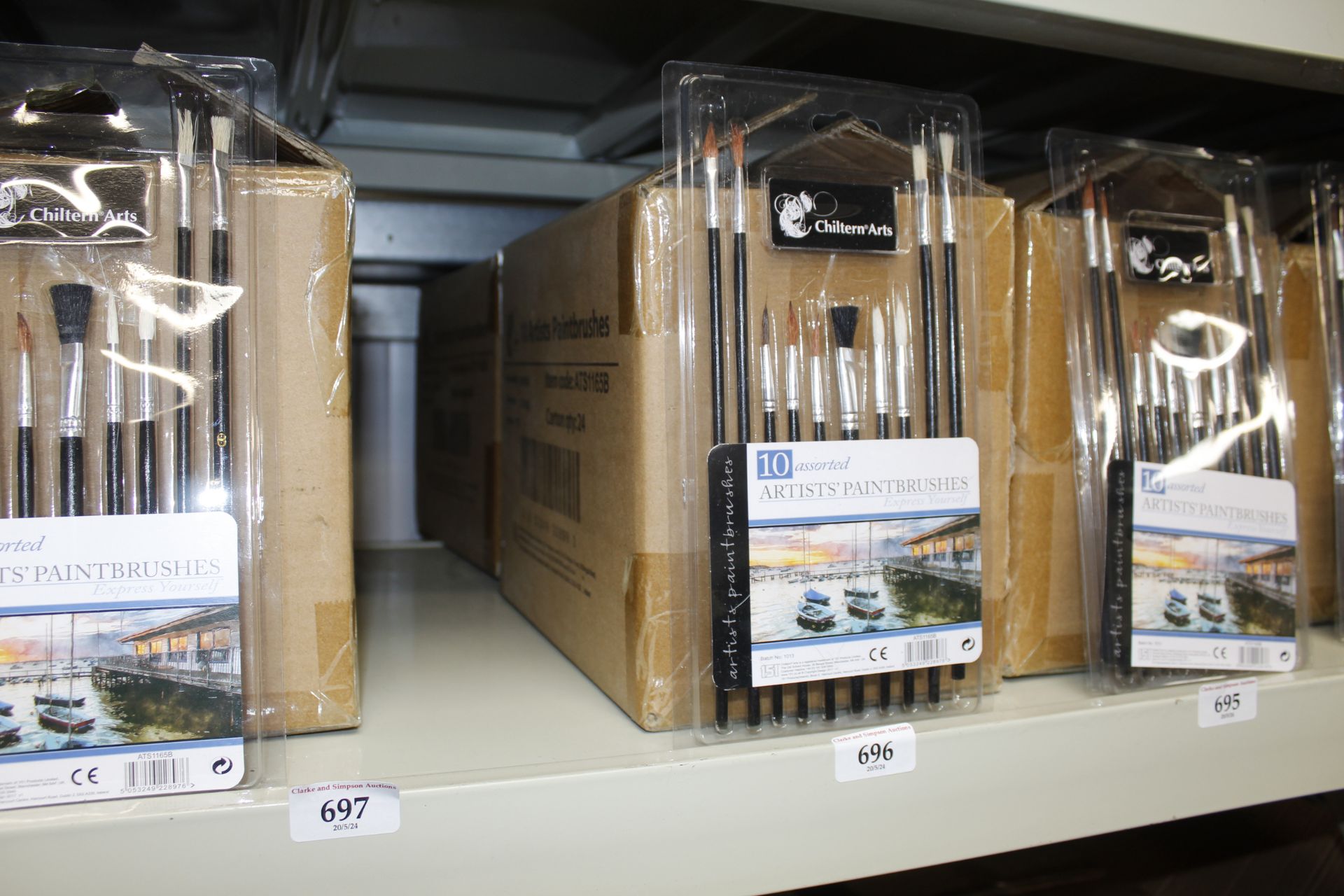 Two boxes containing sets of ten assorted paint brushes