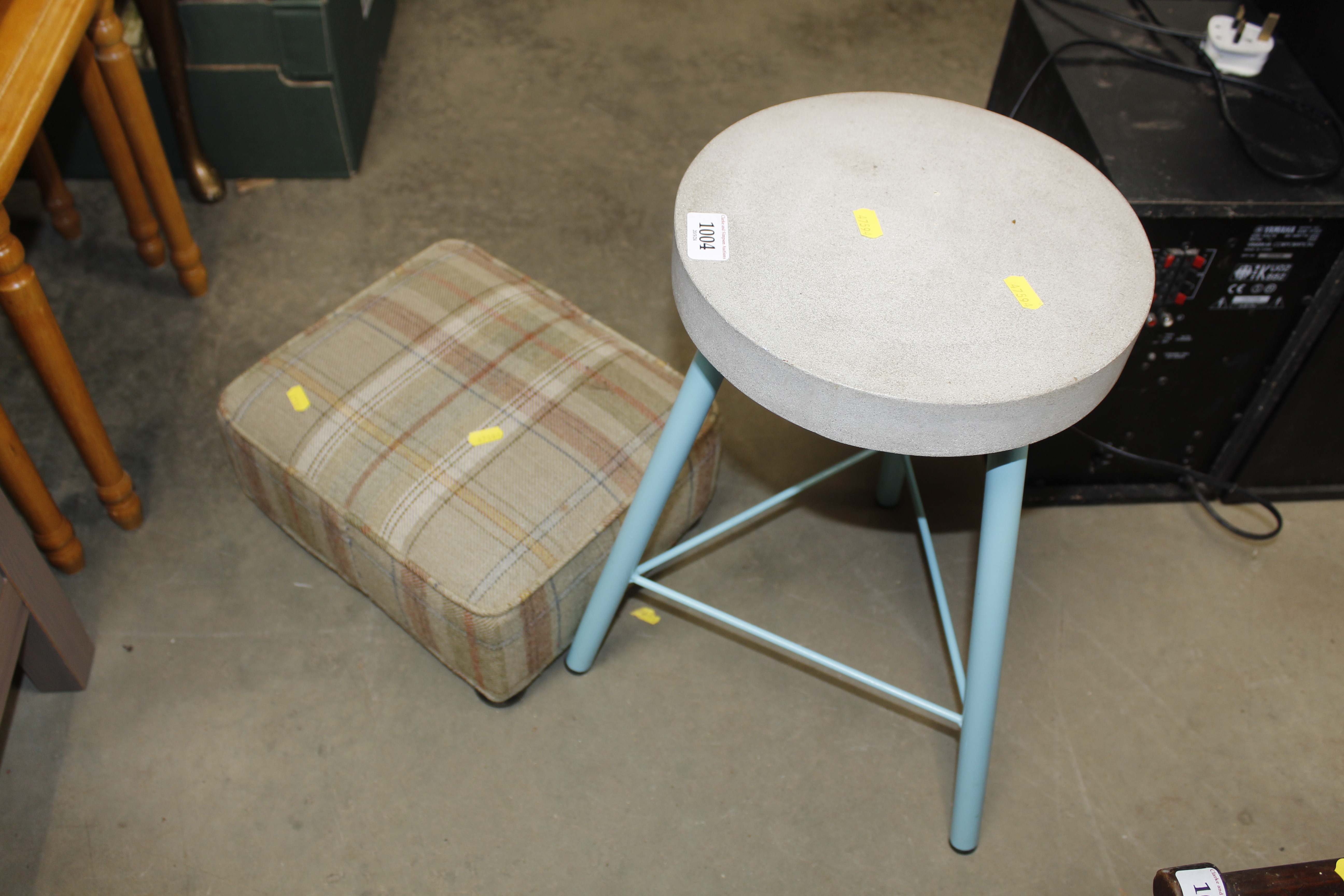 A stone seated stool and a footstool
