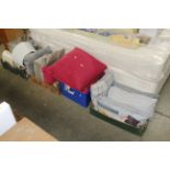 Three boxes containing cushions, blankets and thro