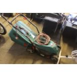 A Bosch Rotak 34R electric garden lawn mower