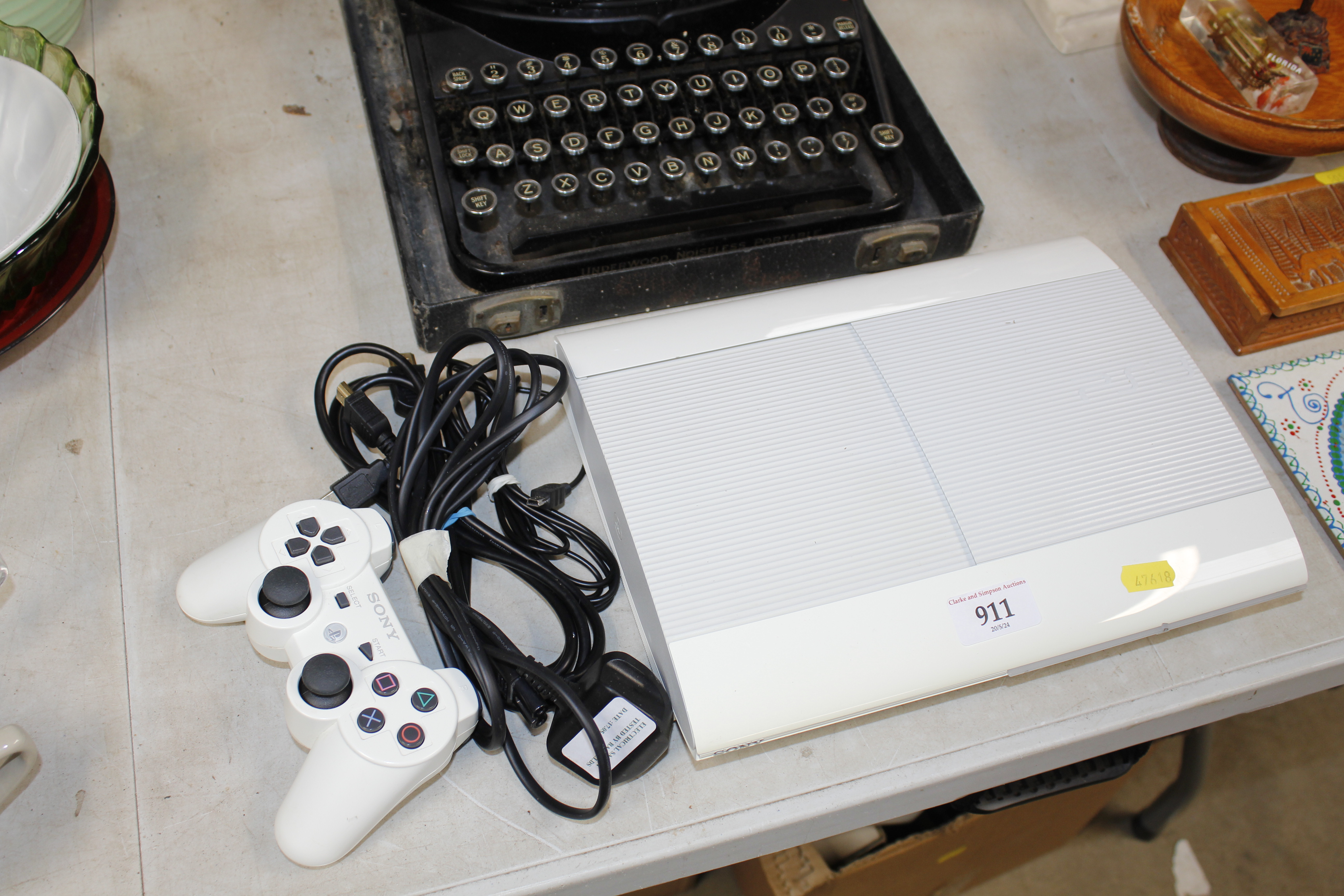 A Sony PlayStation III with remote control