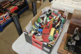 A box of die cast and other vehicles