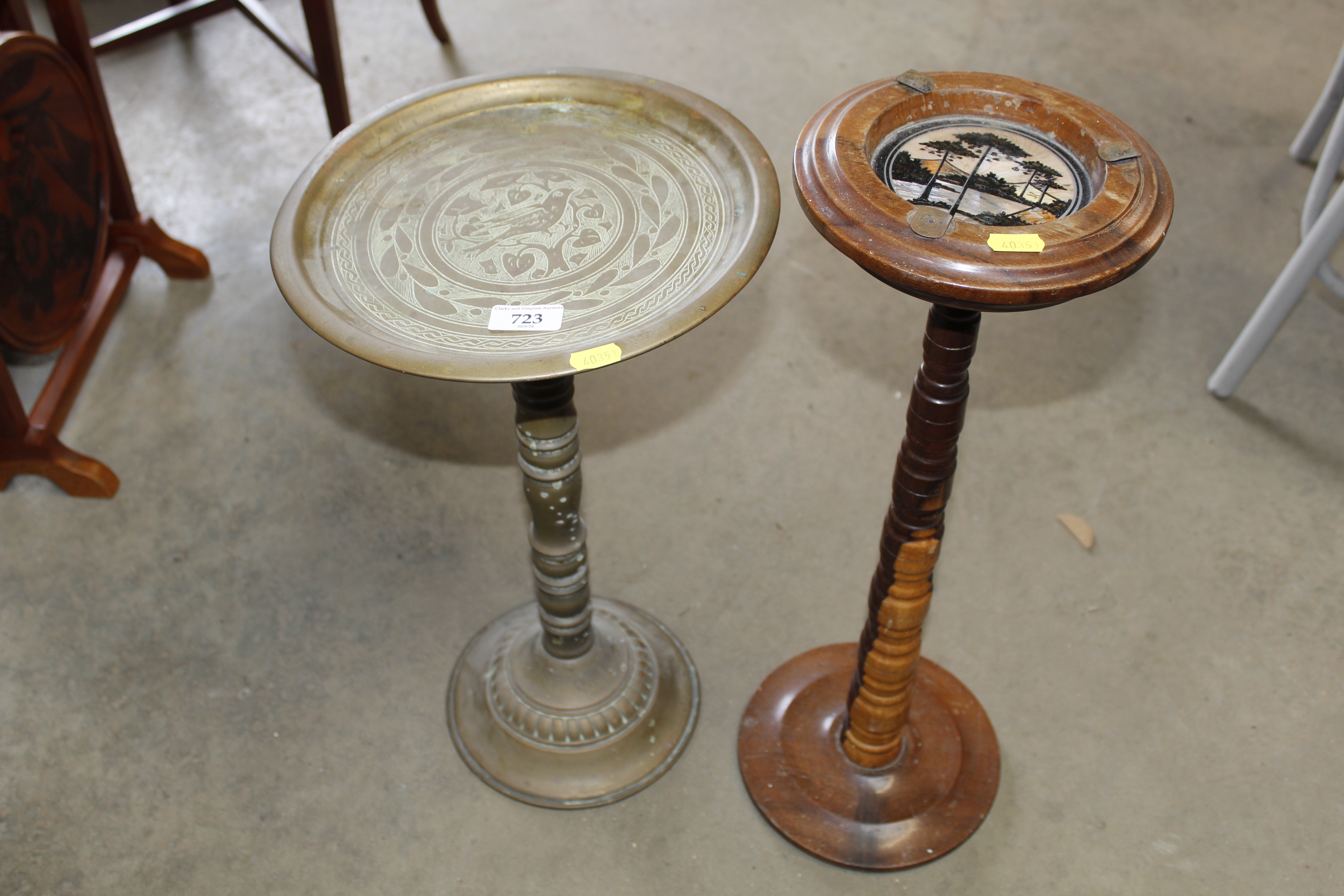 A turned wooden smokers stand and a brass stand