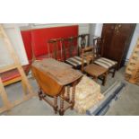 An oak drop leaf table, three Chippendale style ch