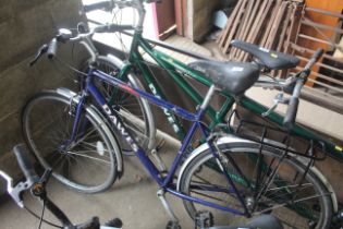 A Dawes red feather gents bicycle with front and r
