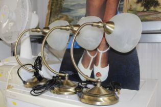 Three adjustable table lamps