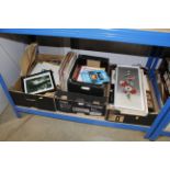 Three boxes containing various pictures and prints