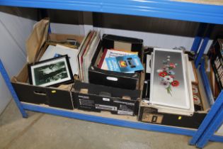 Three boxes containing various pictures and prints