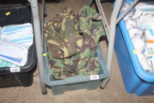 A quantity of various camouflage clothing packs et