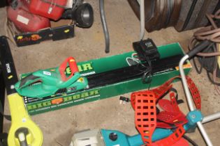 A Big Bear cordless electric hedge trimmer with ba