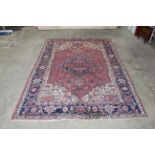 An approx. 9" x 6" blue and red patterned rug