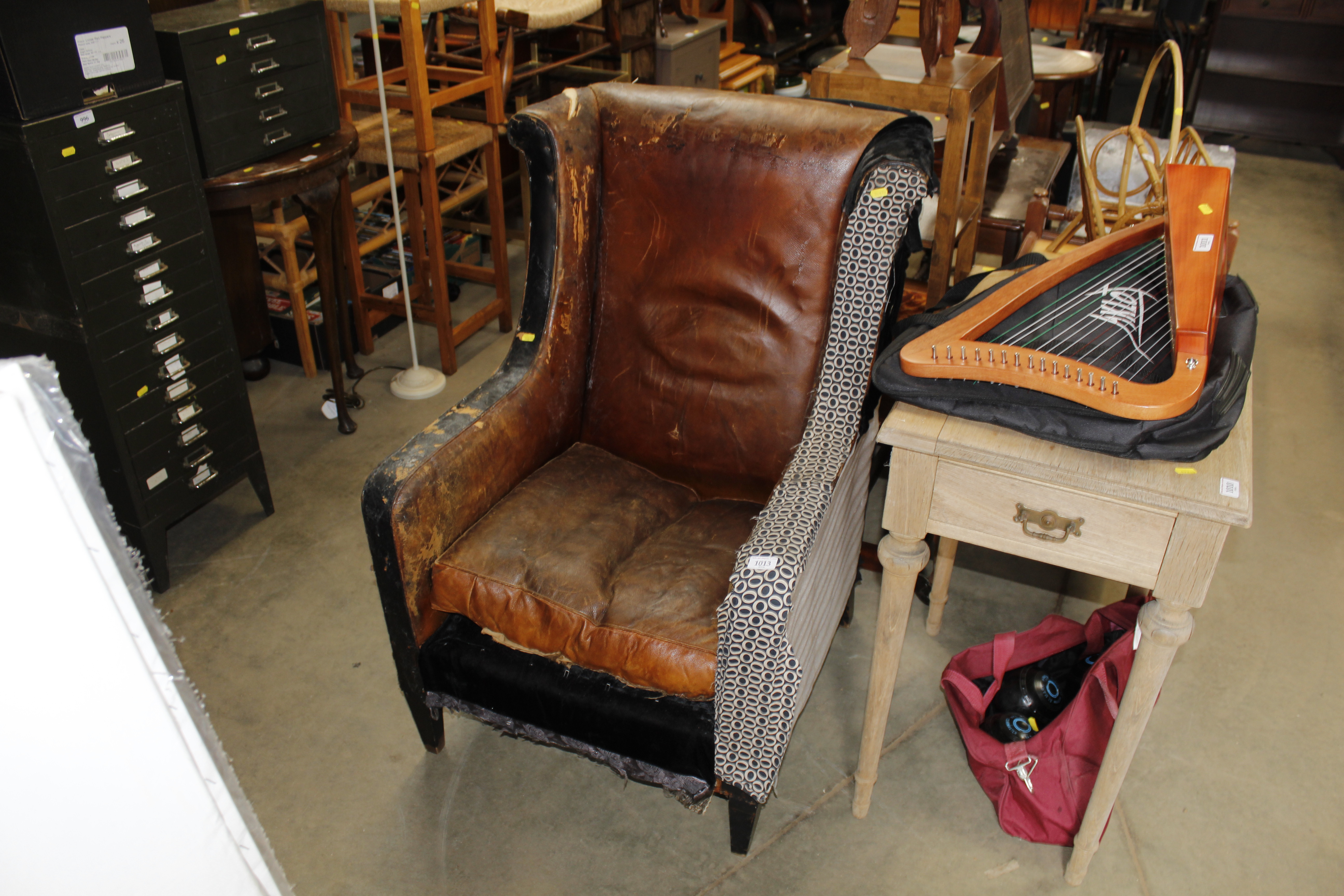 A leather upholstered armchair for restoration