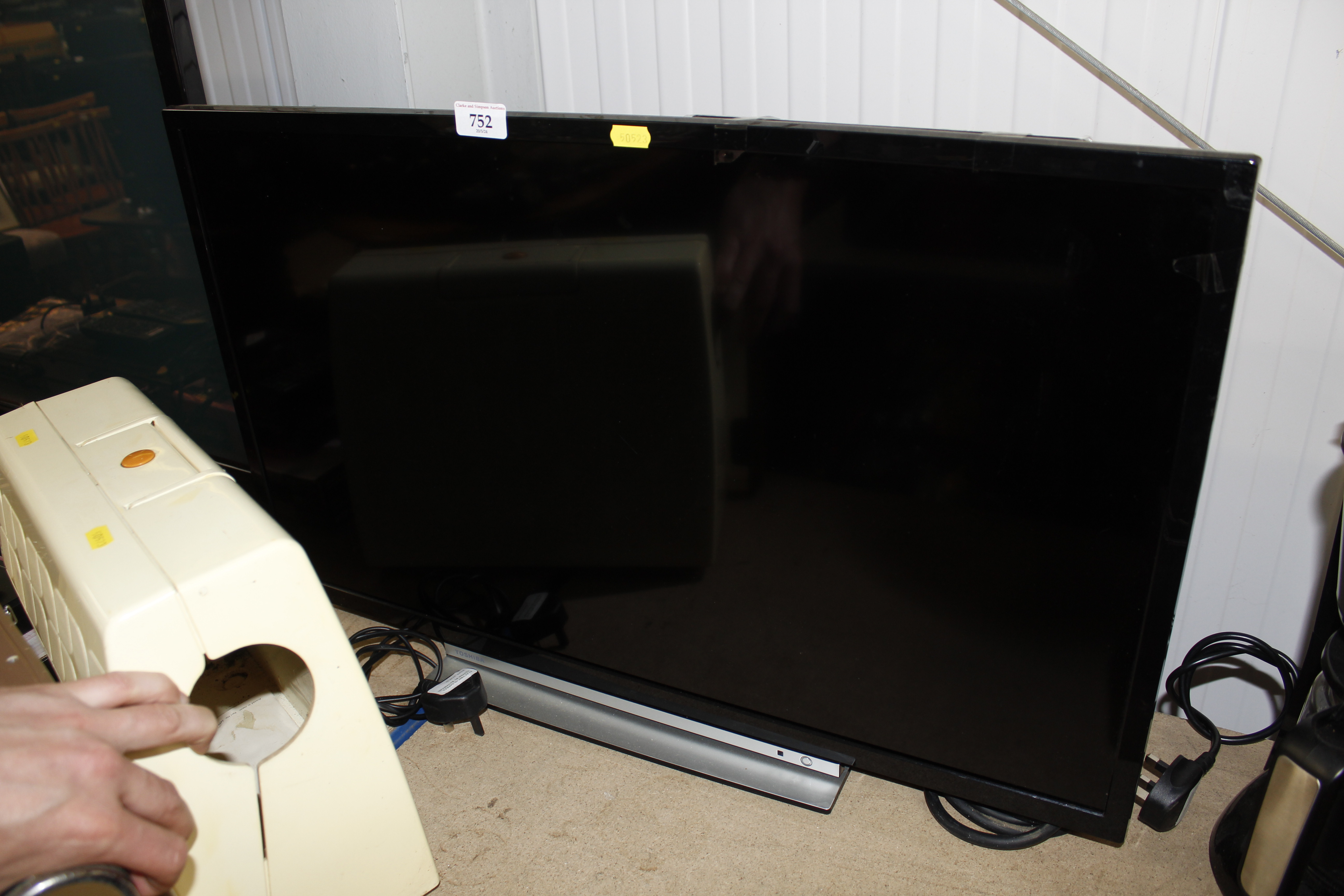 A Toshiba television with remote control