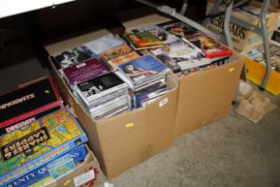 Two boxes of DVDs and CDs