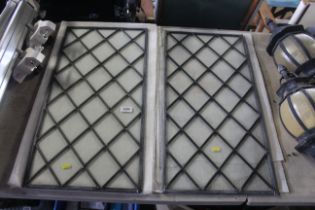 Two leaded glazed window panels measuring approx.