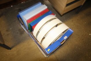 A box containing various paper folders and a ceili