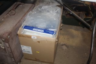 A box containing a large quantity of plastic face