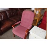 A pink upholstered chair