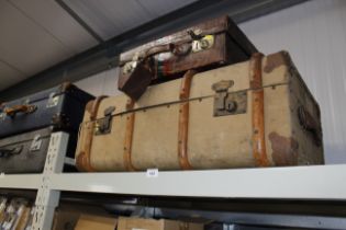A vintage case and a wooden bound travelling trunk