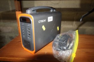 A CTechi T240 portable power station with charger