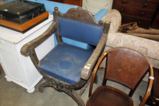 A late Victorian carved oak chair raised on x-fram