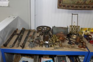 A collection of metalware to include brass sprayers, blow lamp, brass heavy horse bridle rosettes