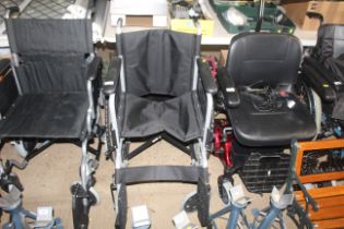 A folding self propelled wheel chair. This lot is
