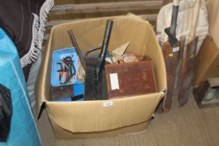 A box containing various items including shovel he