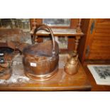 A copper coal scuttle and a copper kettle