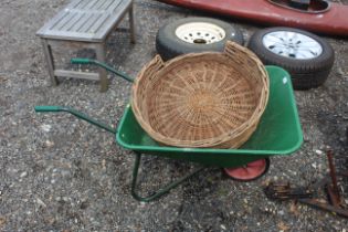 A lightweight plastic garden wheelbarrow and a wic