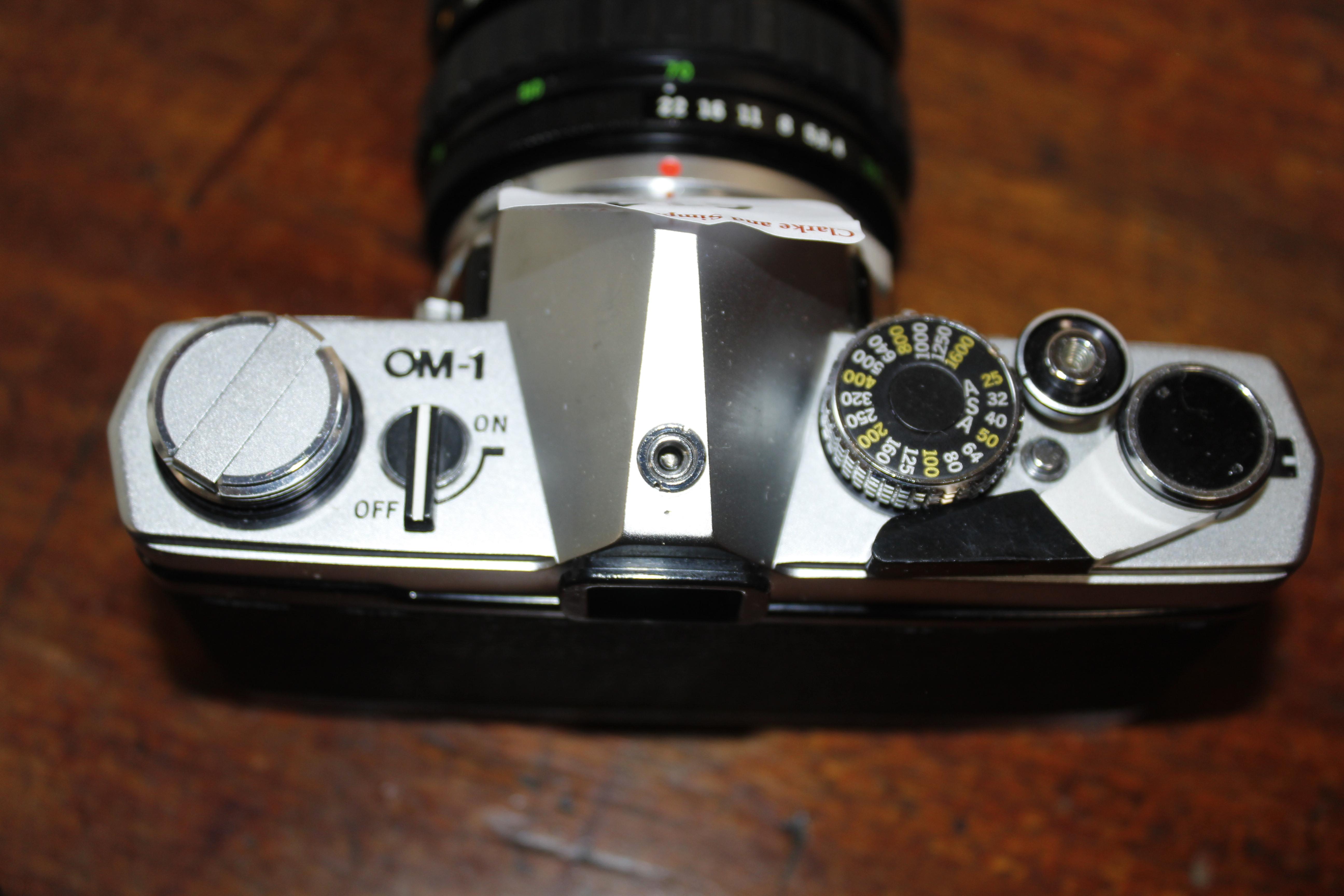 An Olympus OM-1 camera and two lenses - Image 2 of 2