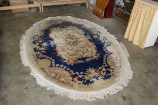 An approx. 10" x 7" floral pattered rug AF